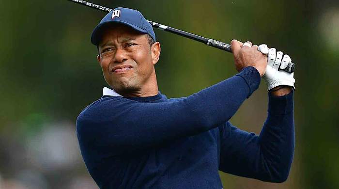 Tiger Woods tees off during the 2023 Genesis Invitational golf tournament.